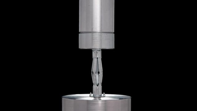 deformation of metal parts under hydraulic press, close-up