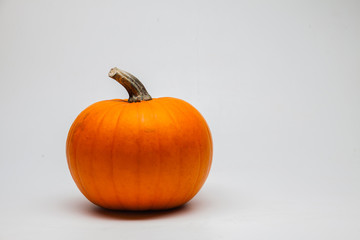 Yellow autumn pumpkin isolated on white background
