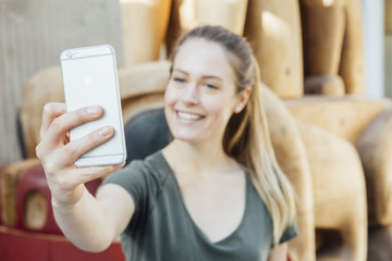 Woman in her twenties taking a selfie or videocalling