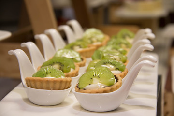 Single Kiwi tart on a small cup