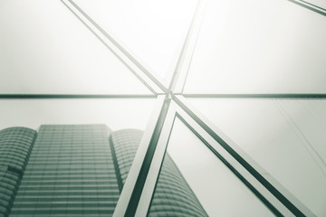 Bottom up view of Modern office building in green color