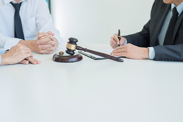 Judge gavel with Justice lawyers deciding, consultation on marriage divorce between married couple...