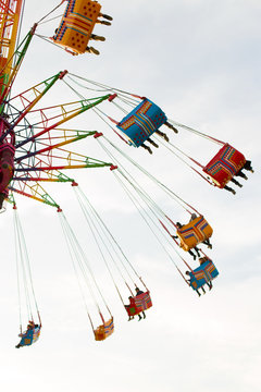 People who enjoy the attraction. High in the sky, a fun family day in an amusement park