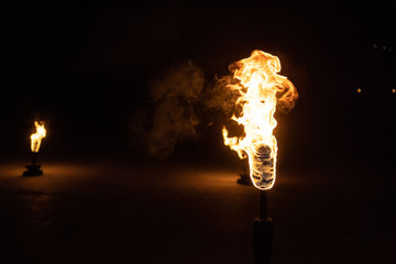 Burning Torch in the Night at black background
