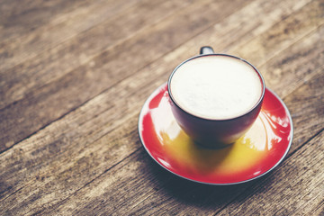 coffee latte art in red cup, vintage filter image