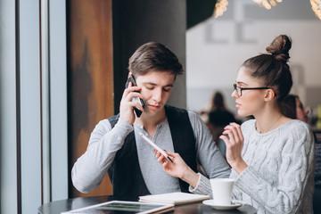 Guy and girl at a meeting in a cafe