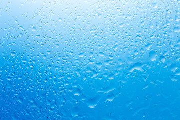 a drop of water on the glass against the light