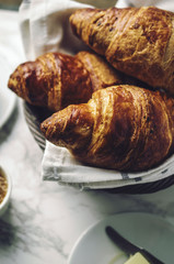 Breakfast croissants with jams and espresso