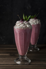 Cherry milkshake with whipped cream 
