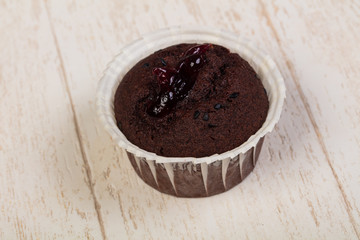 Tasty muffin over wooden