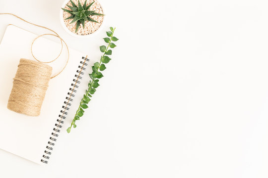 Flat lay photo sack rope on notepad on white background, white copy space for you product