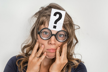 Woman with question mark on paper over her forehead
