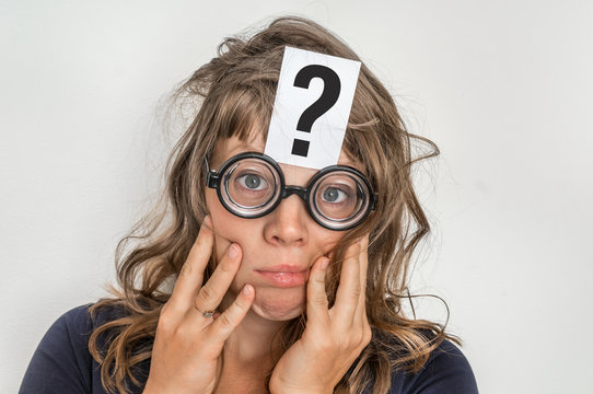 Woman with question mark on paper over her forehead