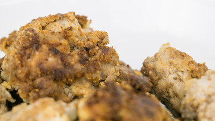 Fried homemade chops on a white background.