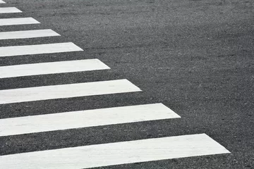 Deurstickers Zebra crosswalk on a asphalt road - closeup background © sema_srinouljan