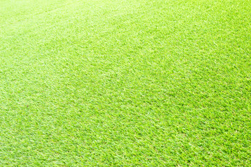 Beautiful Green artificial grass background vignette or the naturally walls texture Ideal for use in the design fairly. natural pattern texture fresh spring from golf course or  soccer field.