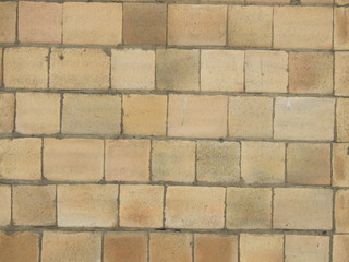  Wall of yellow stone blocks, background