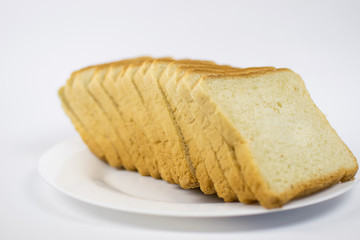 Toast bread on a white plate.