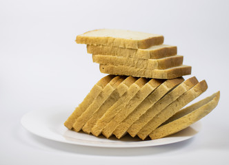 Toast bread on a white plate.