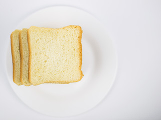 Toast bread on a white plate.