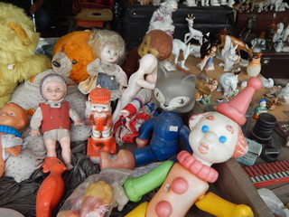 Large selection of vintage dolls and children's toys on the flea market