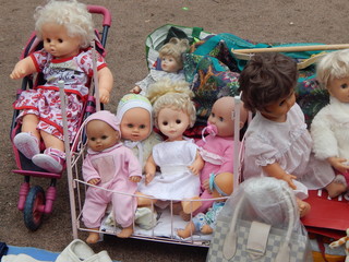 Large selection of vintage dolls and children's toys on the flea market
