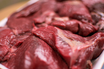 Sliced raw beef.