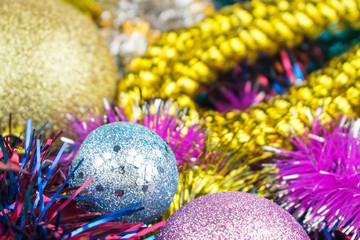 Obraz na płótnie Canvas Background of multi-colored Christmas decorations and toys.