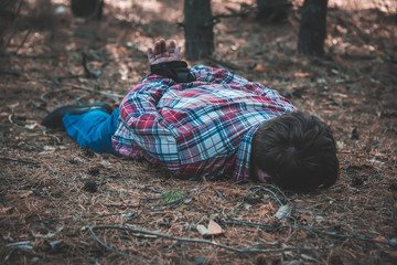 corpse of a man in the woods