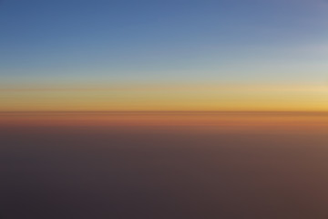 Sunset sky view from airplane window. Sunset in the sky.