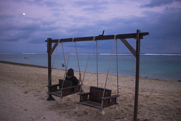 beach view at noon with swing chair
