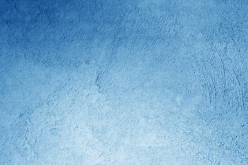 Grungy cement wall in navy blue color.