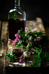 Bitter tincture with mint and clover.style rustic