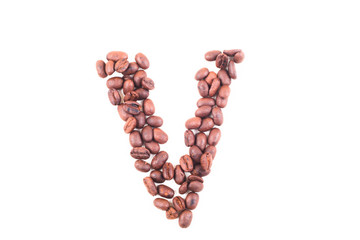 The alphabet V from roasted coffee beans. Isolated. White background.