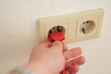hand with plug and socket