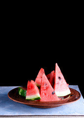 Pieces of a cool and juicy watermelon on a table