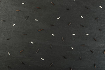 Raw Black Wild Rice on Dark Stone Background