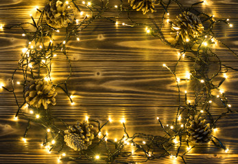 Christmas Light or Garland Lights on Wood Background