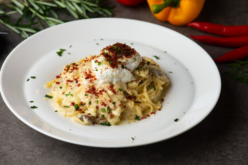 Pasta carbonara and poach egg and chicken