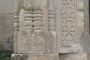 Decorated part of the wall of the temple Bagrati. Old Georgian traditional ornament on stone