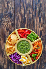 green salsa verde, chips and veggies