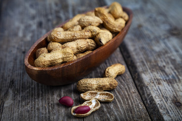 Peanuts in a wooden bowl