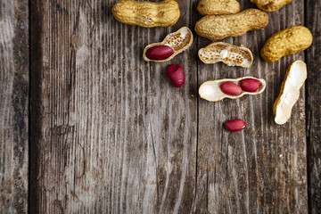 Peanuts on a wooden background.