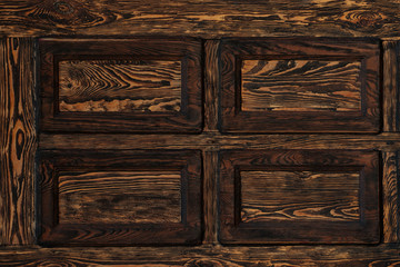 close-up view of dark brown textured wooden background