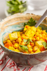 Vegan chickpea vegetables with coconut milk and cilantro.