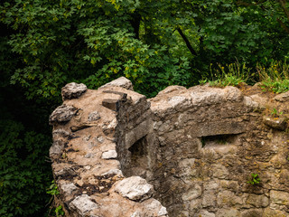 Ancient ruins of a tower wall in a forest in Germany (Drachenfels)