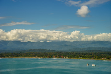 Fototapeta na wymiar Summer panoramic view of the sea and mountain range