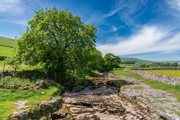Fototapeta na wymiar Yorkshire landscape with the dried-up River Skirfare near Litton, North Yorkshire, England, UK