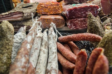 Large assortment of homemade sausages for sale at local street market