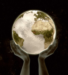 Guinea on globe win hands